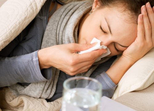 Photo of a woman with a cold and low immune system